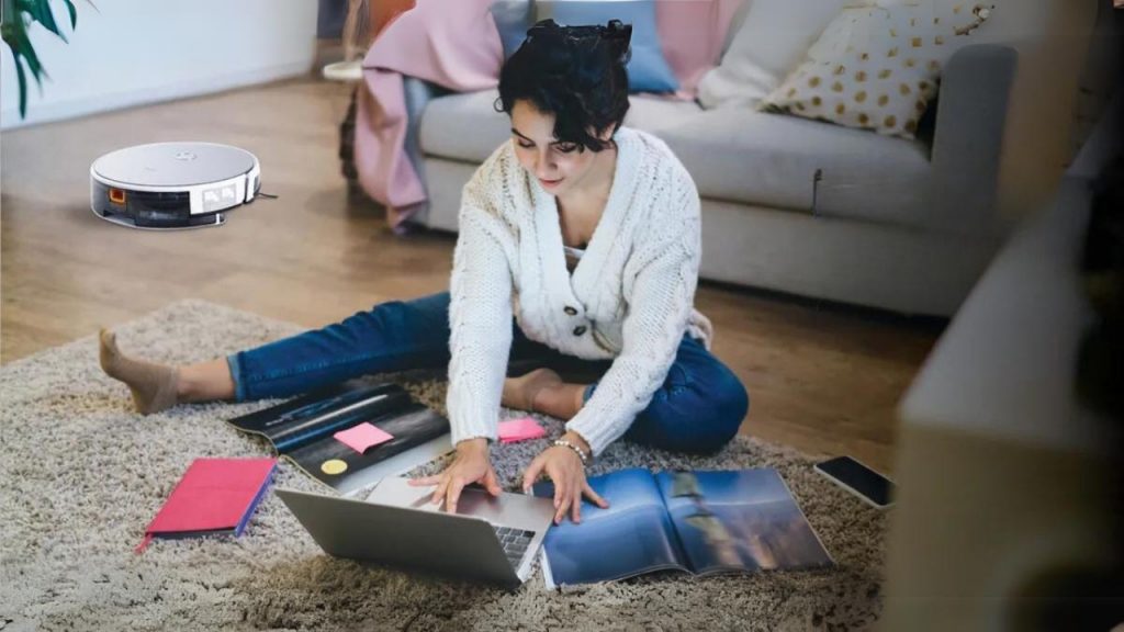 Mother busy Working and robot vacuum cleaner