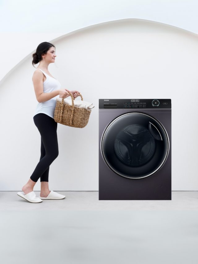 Front load washing machine and woman with basket