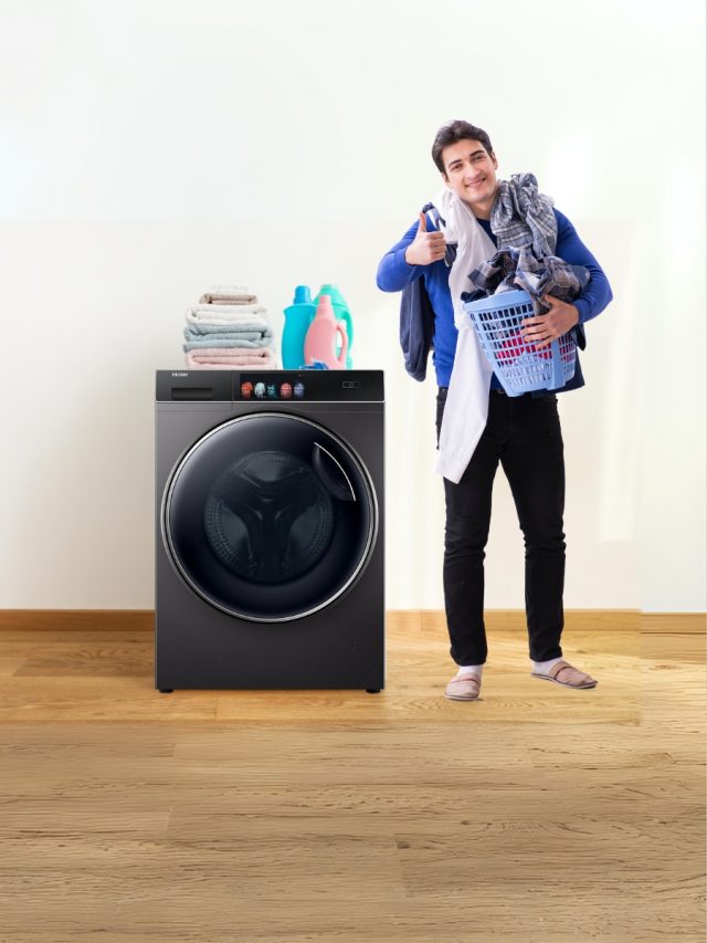 Washing Machine and man holding cloth basket