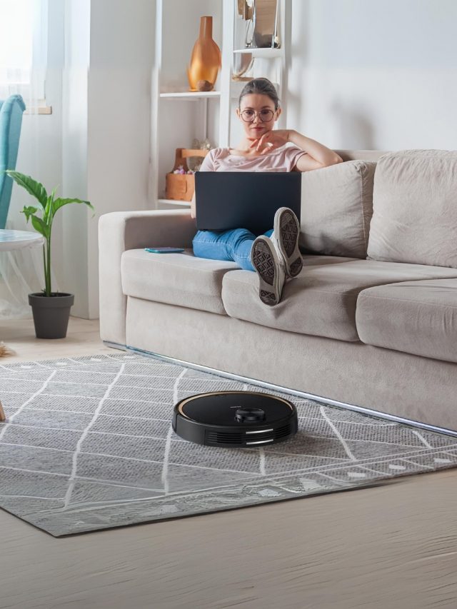 Woman Working and Robot Vacuum Cleaner