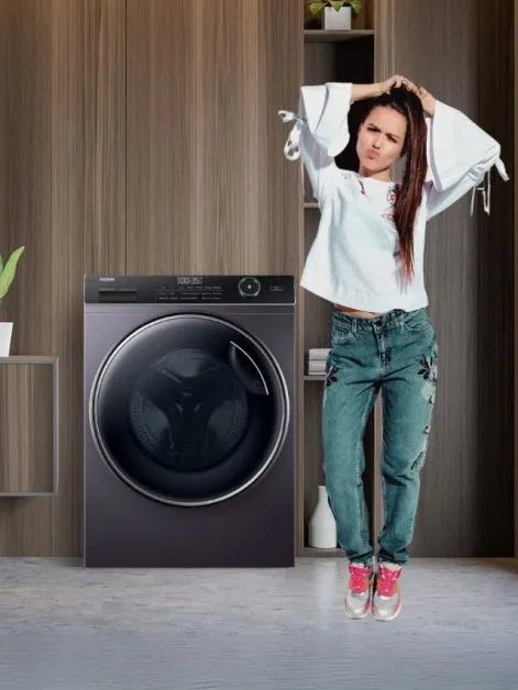 Woman wearing Jeans and washing machine