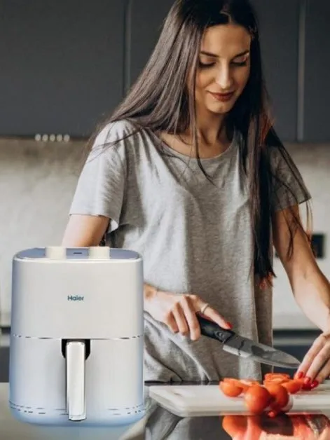 Woman and Air Fryer in Kitchen