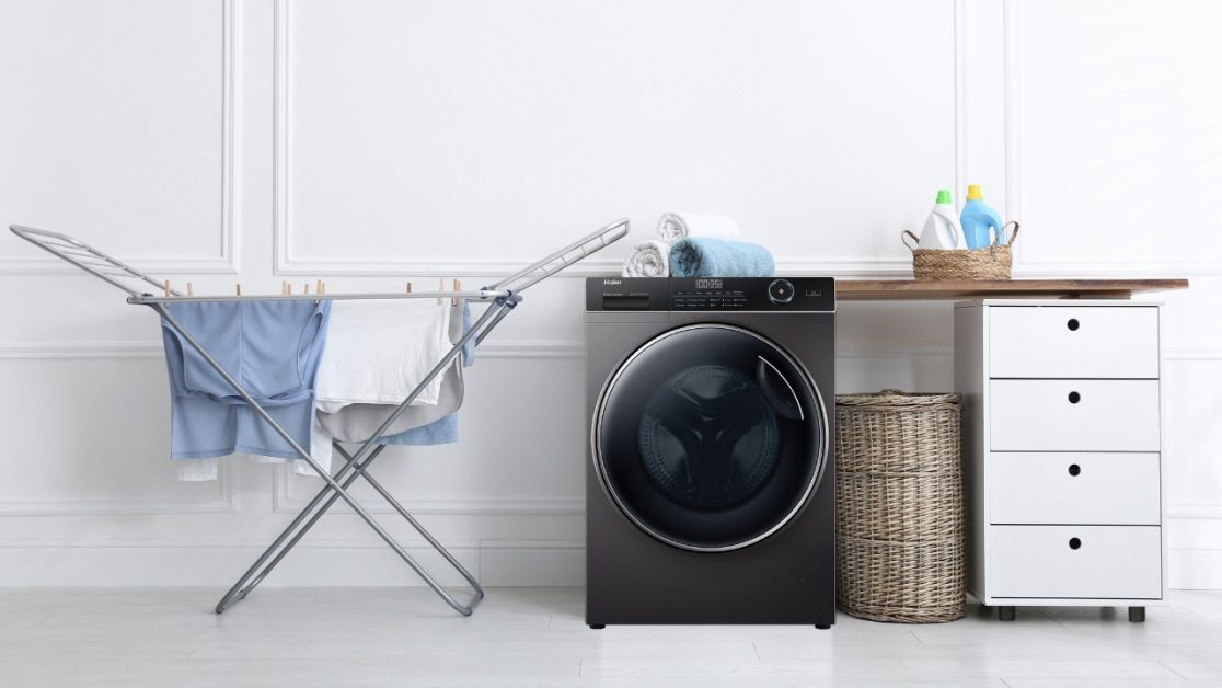 foldable drying stand beside washing machine